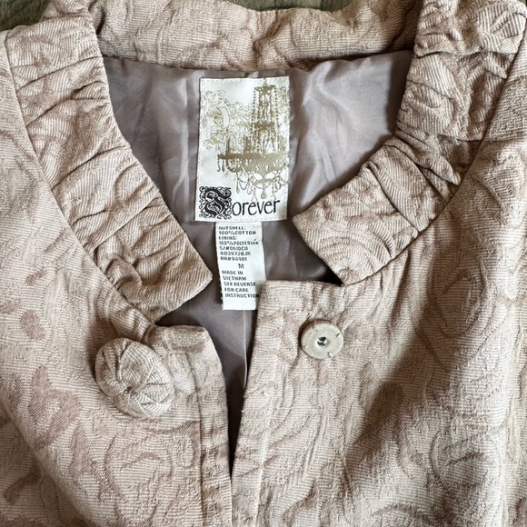 Forever Collectibles Tan Trench Coat with Textured Floral Design - Picture 5 of 15